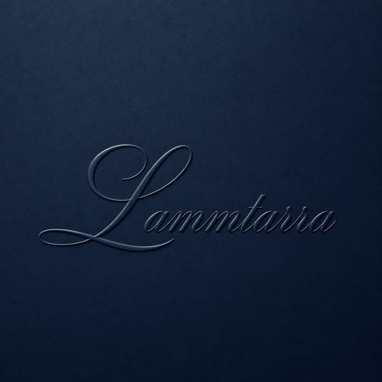 Embossed Lammtarra script wordmark on navy paper